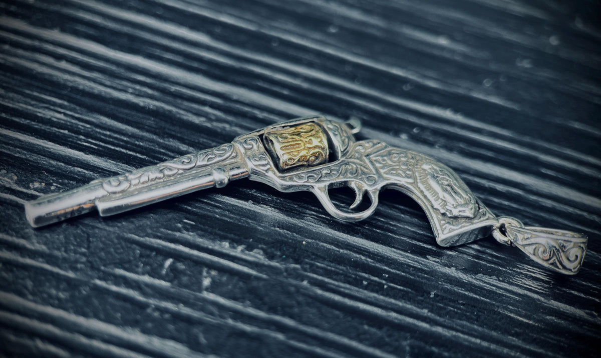 Ornate Engraved Stainless Steel Silver Outlaw Cowboy Revolver Gun Pendant with Gold Plated Cylinder