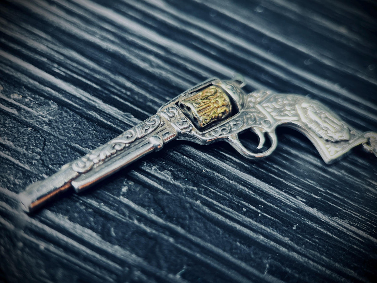 Ornate Engraved Stainless Steel Silver Outlaw Cowboy Revolver Gun Pendant with Gold Plated Cylinder